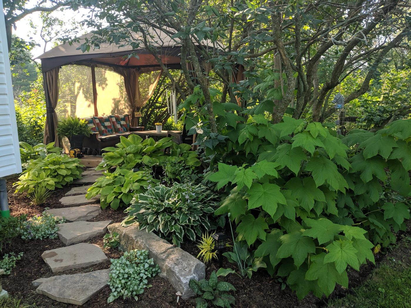 Backyard retreat with stone path and gazebo
